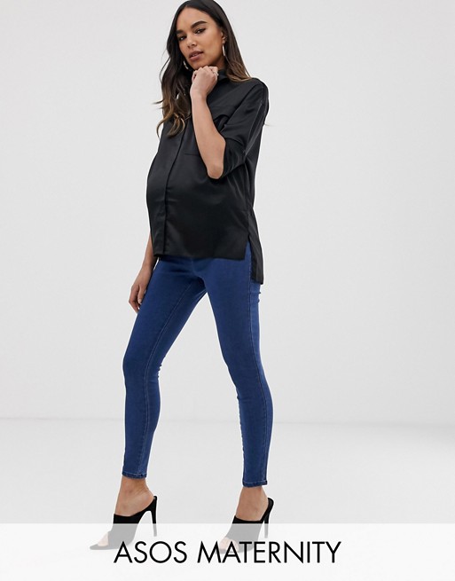 ASOS DESIGN Maternity pull on jeggings in mid wash blue with under .