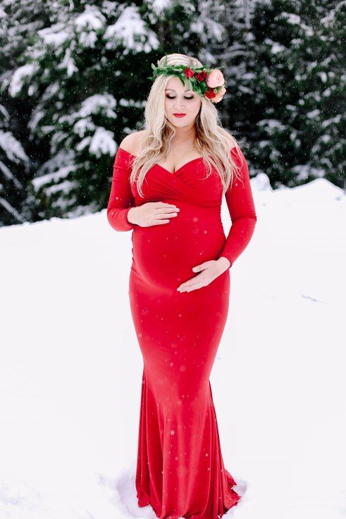 red dress maternity shoot in the snow winter photography floral .