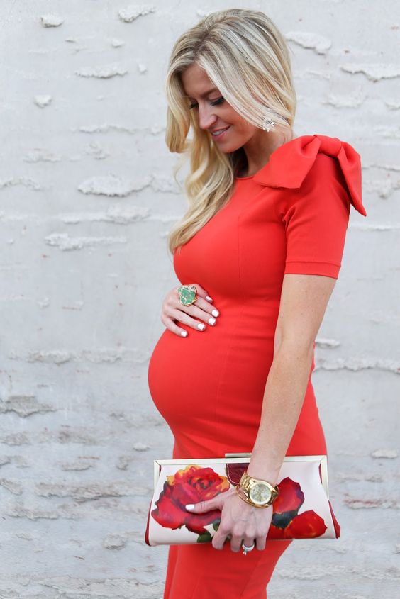 Picture Of red big bow maternity dress with a floral clut